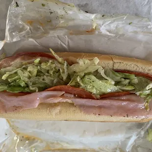 a sub sandwich with lettuce and meat