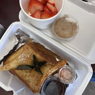 French toast to go , well packaged. Strawberries on the side with syrup &amp; coffee pudding