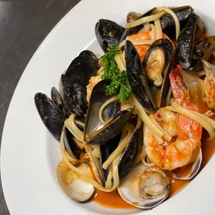 a plate of seafood and pasta