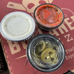 Sides of sauce and jalapeños