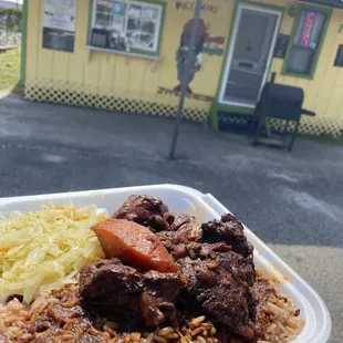 Brown Stew Chicken Dinner with rice and peas side of cabbage