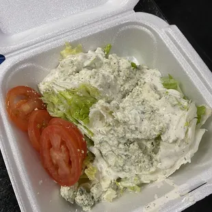 Wedge salad with blue cheese dressing and tomatoes where are the rest of the toppings??