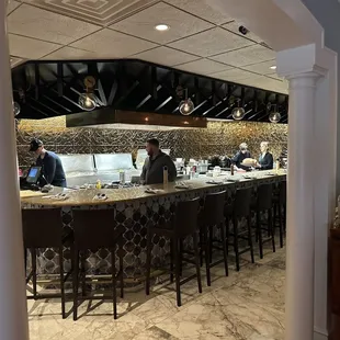 a view of a bar with people in it