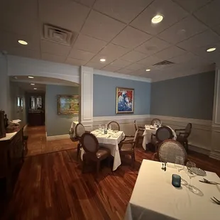 a dining room with tables and chairs
