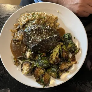 Short rib with mushroom risotto and crispy brussel sprouts.