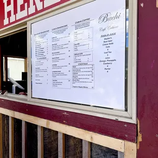 a menu in a window of a restaurant