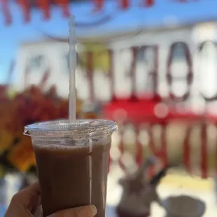 a person holding a cup of coffee