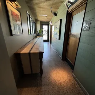 This long table is where the bathrooms are. A group of ladies left the bathroom as I was approaching. I had to back out to let them through.