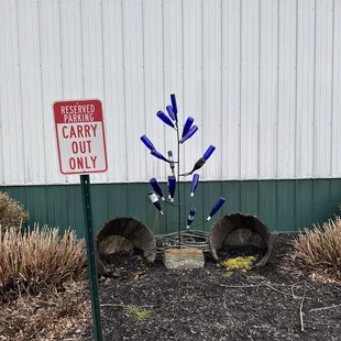 Cute wine bottle display outside.