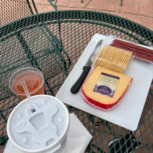 Roadhouse Red Slushy A glass of Sunset Blush wine Gouda cheese Beef sticks and crackers!