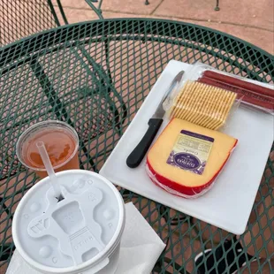 Roadhouse Red Slushy  Gouda cheese Blush glass of wine  Crackers  Beef sticks