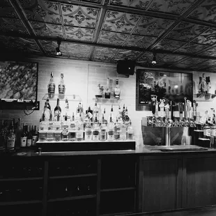 a woman standing at the bar