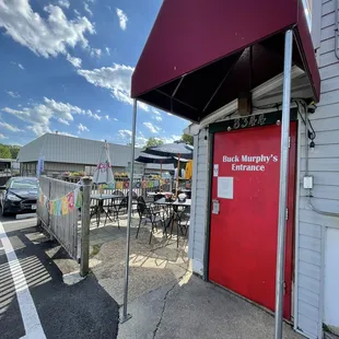 a red door in front of a restaurant