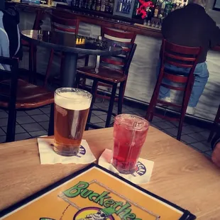 a menu and two glasses of beer