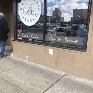 a man walking down the sidewalk