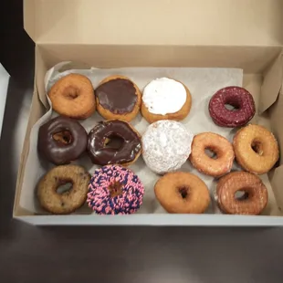a variety of donuts in a box