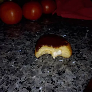 a half eaten donut on a counter
