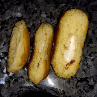 Started cutting the donut to see how far back the cream was.