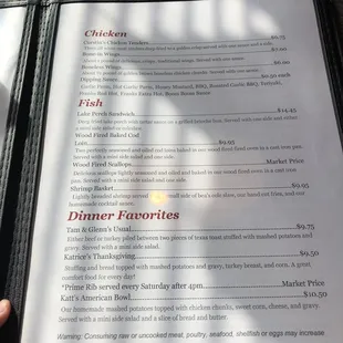 a person holding a menu