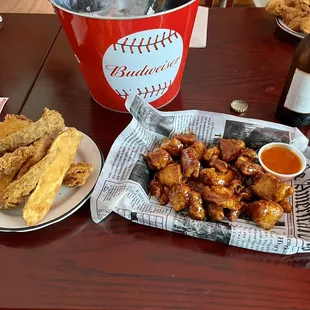 Teriyaki boneless wings and potato wedges