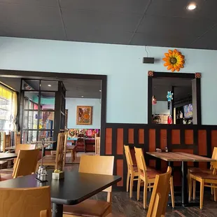 a dining area with tables and chairs