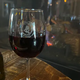 a glass of wine on a table