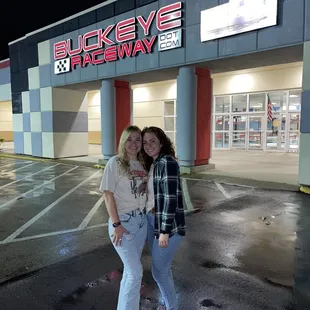 Outside with entry in background.