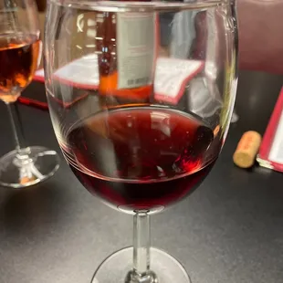 a glass of wine on a table