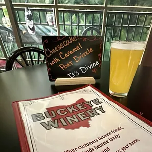 a menu and a glass of beer