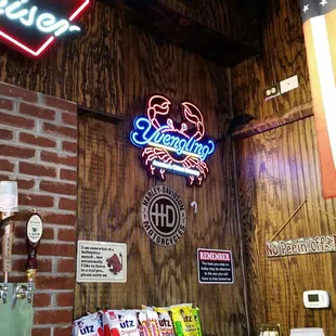 a brick wall and a neon sign