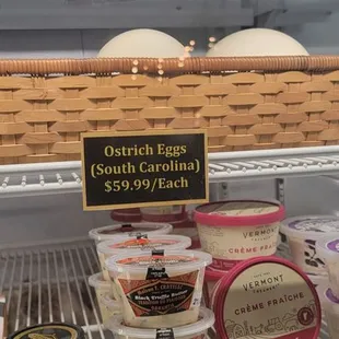 a display of cheeses and dips