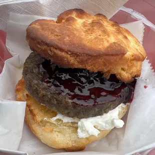 a sausage sandwich on a biscuit