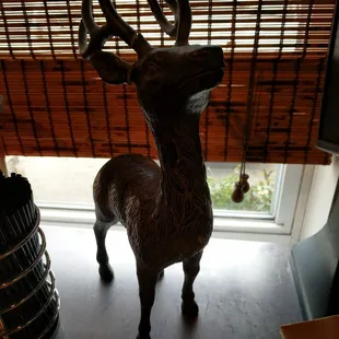 a close up of a deer statue
