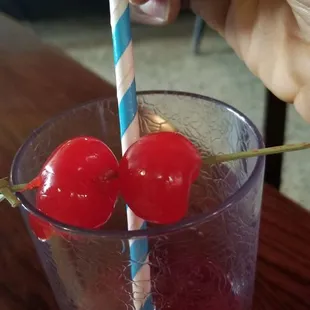 Cranapple-cherrries (removing straw so  eating the cherries  could less ambiguous)