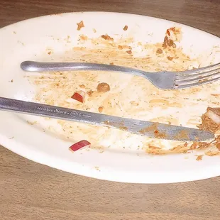 This is the plate after eating the chili cheese dog. She saved something for the dishwasher to do