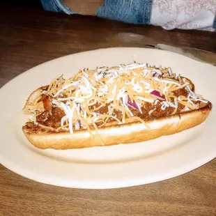 Open faced chili cheese dog. Chili is definitely homemade, and fixings are on the side for tastes. It was delicious