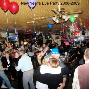 a crowd of people at a new year's eve party