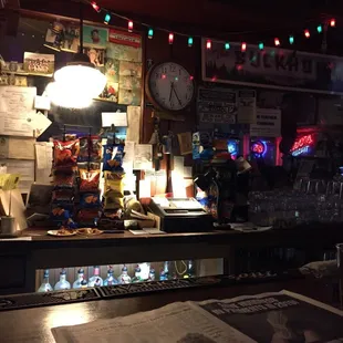 a bar with a menu and a clock