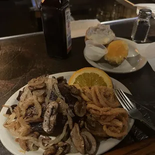 Filet Mignon with onions and mushrooms. Stuffed potato.