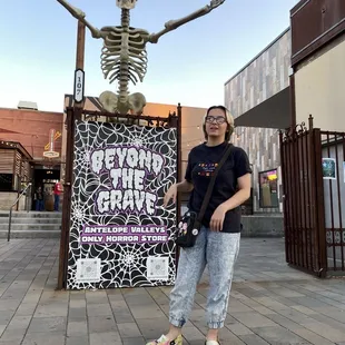 The entrance is back and to the left of this skeleton.