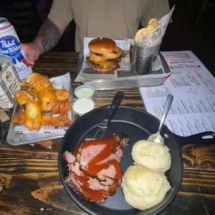 a man sitting at a table with food