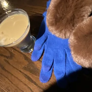 a teddy bear and a glass of beer