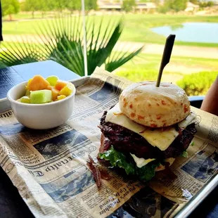 a sandwich and a bowl of fruit