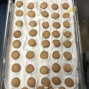 a pan of cake with white icing