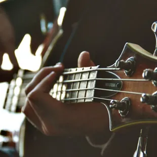 a person playing a guitar