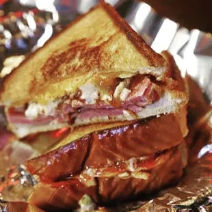 a grilled sandwich on tin foil