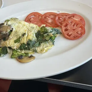 Vegetable omelette with tomato slices
