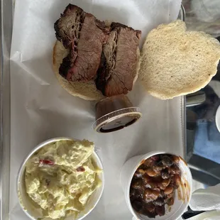 Brisket sandwich, potato salad, and cowboy beans