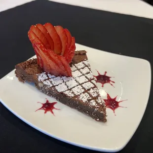 Chocolate Torte
Dark chocolate flourless cake on a berry compote reduction.