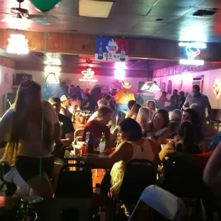 a crowd of people sitting at tables
